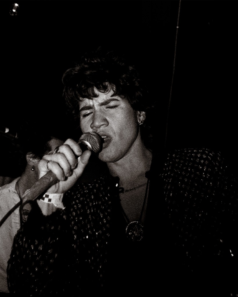 Vocalist in sequined jacket, black and white